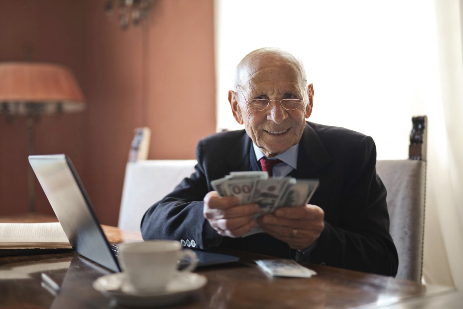 Old Man Holding the Money